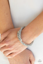 Load image into Gallery viewer, Roll Out The Glitz Paparazzi Coil Bracelet - Silver - August 2021 Life Of The Party Exclusive
